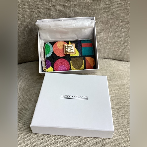 Dooney & Bourke Handbags - Dooney & Bourke Art Deco Large Zip around credit card case. NWT in Black